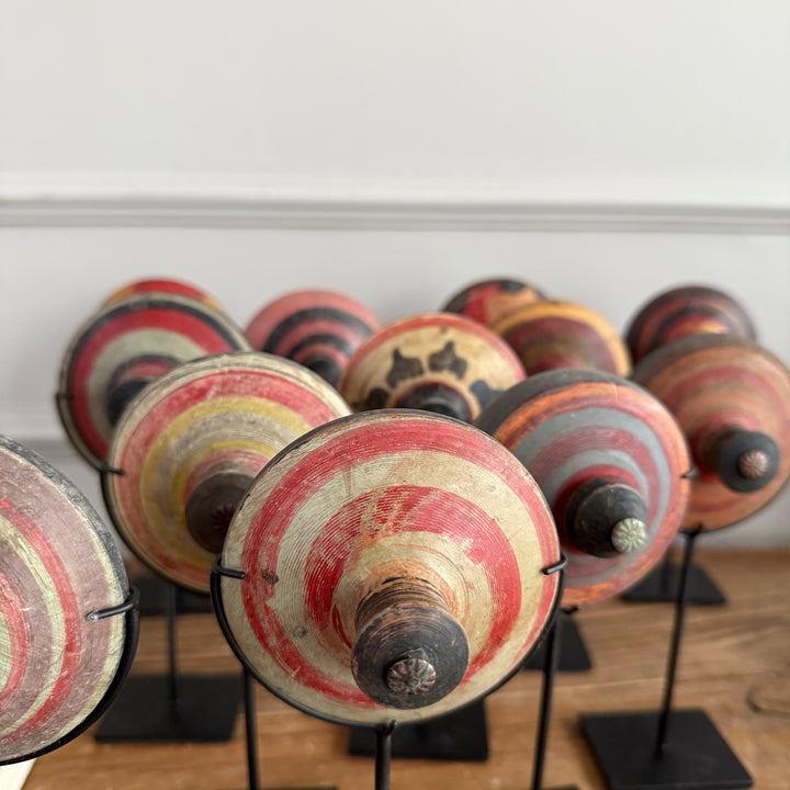 Antique small spinning top on stand