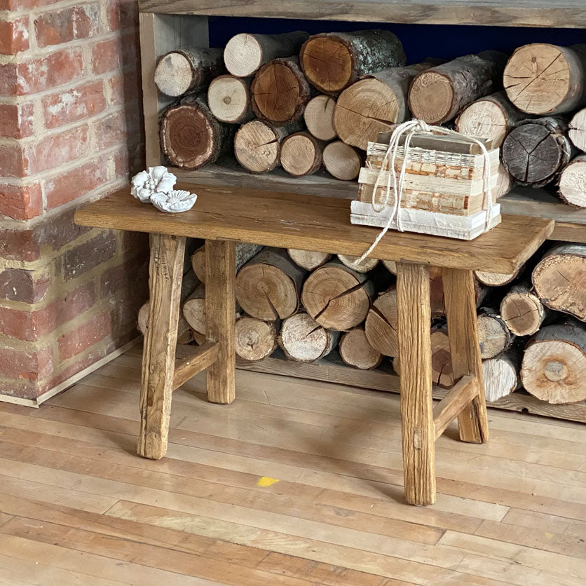 A beautifully weathered rustic reclaimed utility bench made from reclaimed timbers.  The beautiful weathered top is made from salvaged elm and the legs from salvaged Elm timber