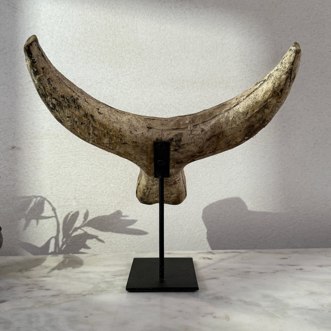 Primitive wooden cow horn sculpture