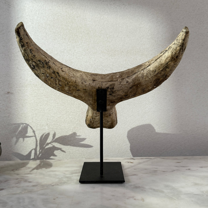 Primitive wooden cow horn sculpture