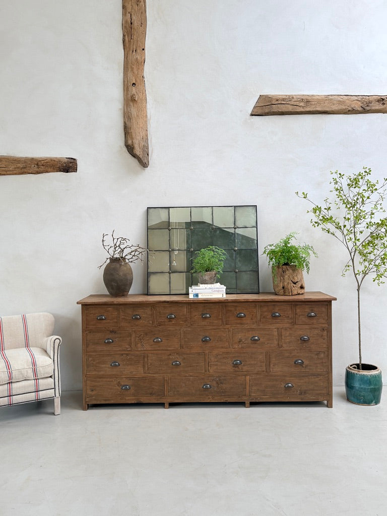 The Chiswick Multi Drawer Chest styled with artisan ceramics, botanical arrangements and decorative accessories, illustrating how handcrafted teak furniture creates warmth and character within contemporary country homes.