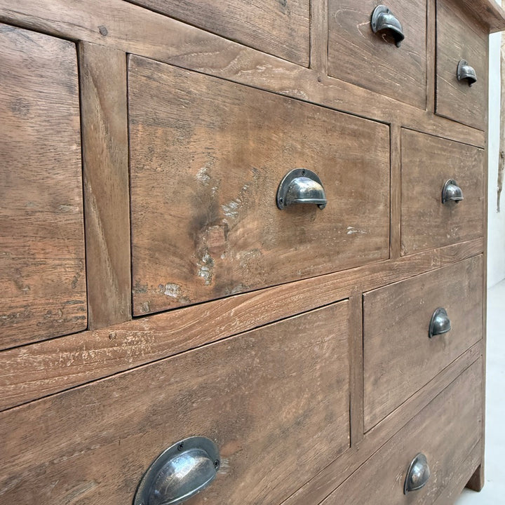 Close-up of the Chiswick Dark Wood Multi Drawer Chest showcasing the rich natural grain, warm dark teak finish and beautifully aged texture that make every handcrafted cabinet unique.