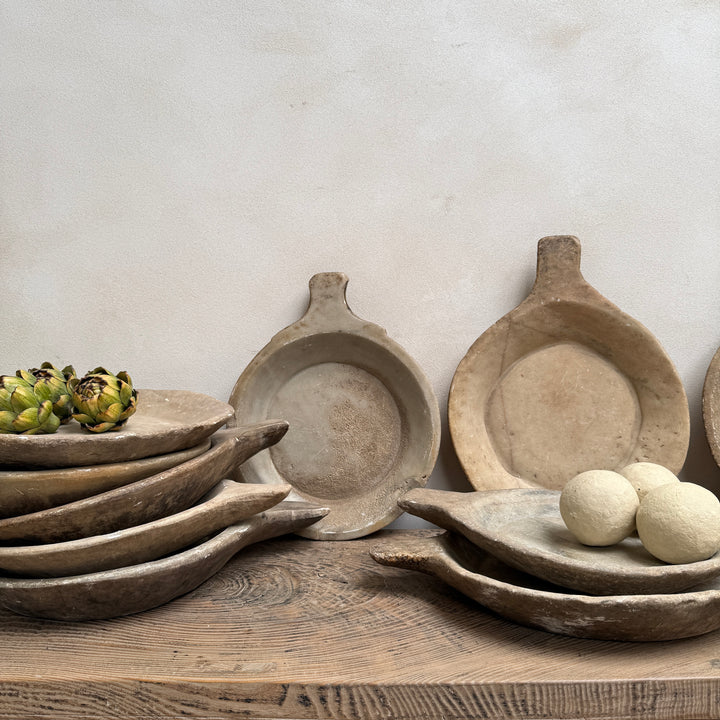 Collection of antique Indian marble bowls hand carved from natural stone, displayed together as decorative rustic home accessories.