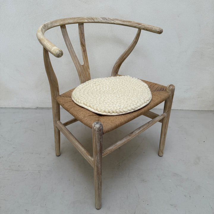 Curled wool seat pad