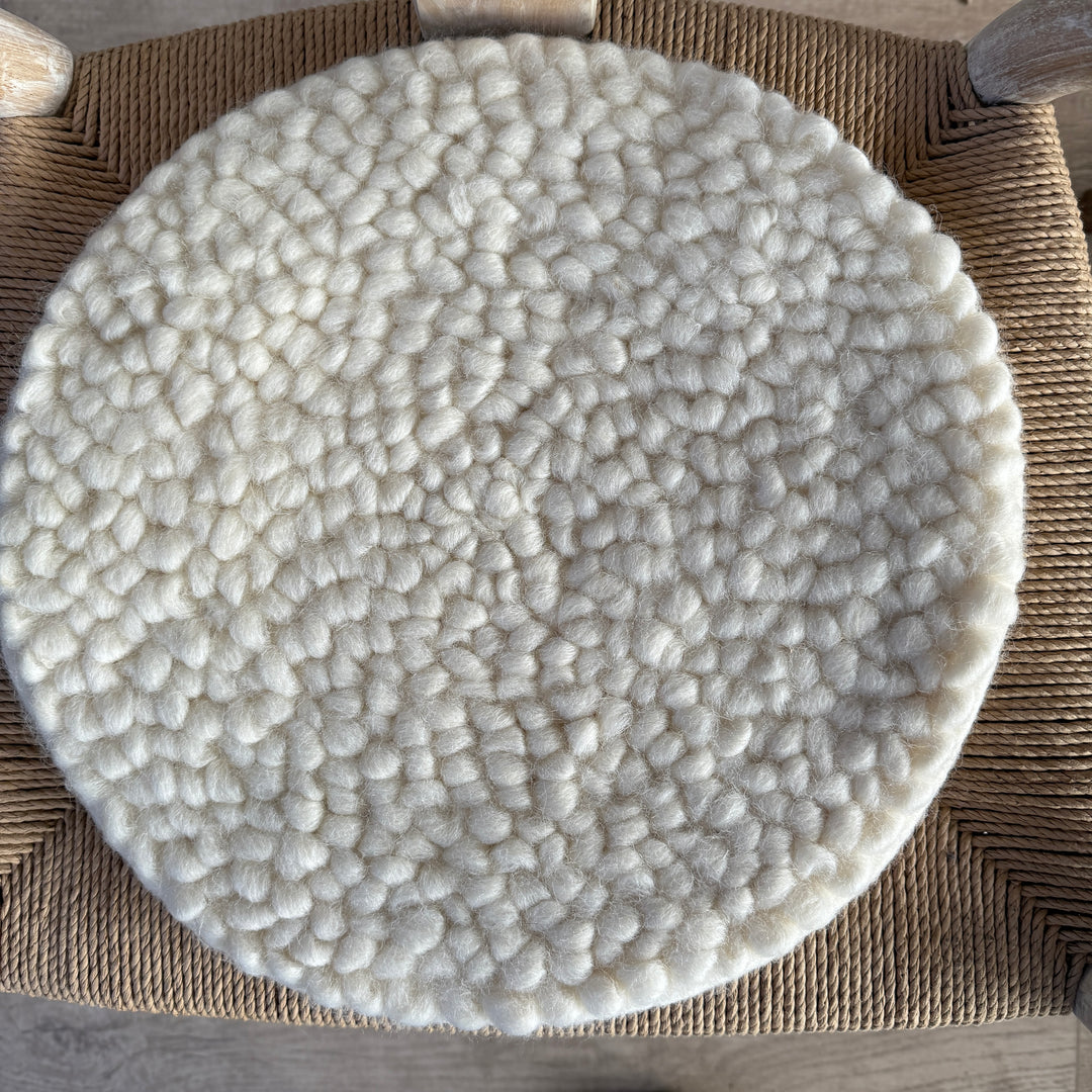 Curled wool seat pad