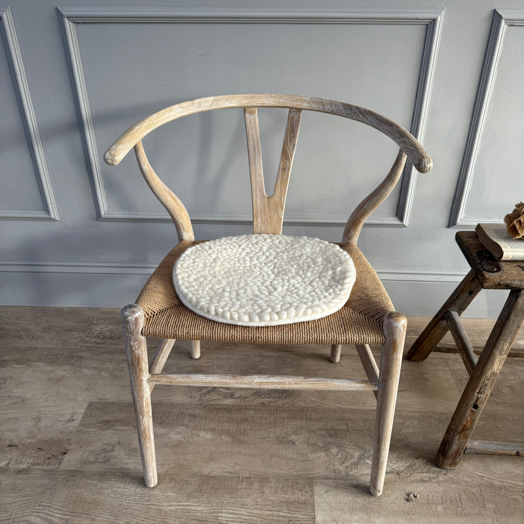 Curled wool seat pad