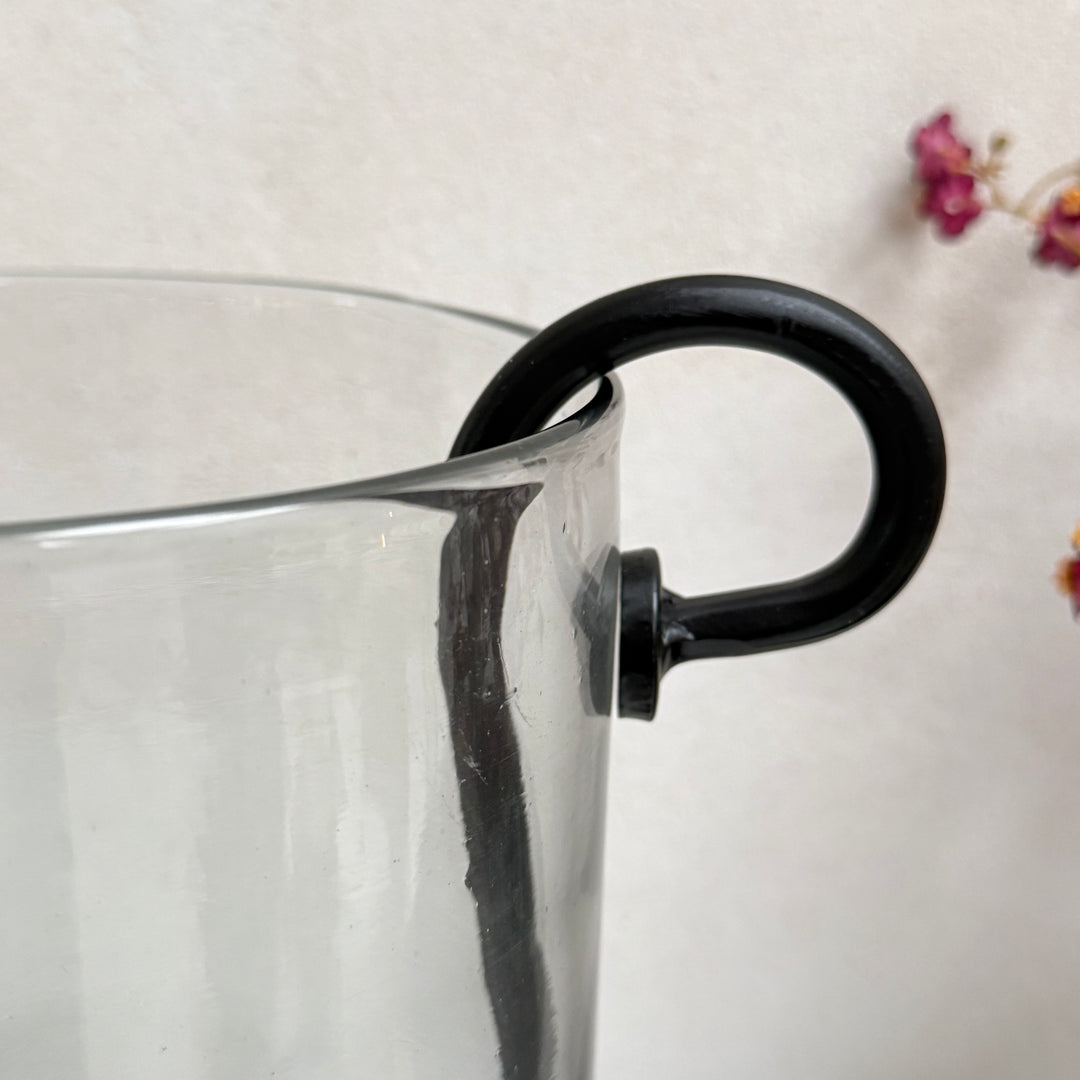 Glass hurricane lantern and candle holder