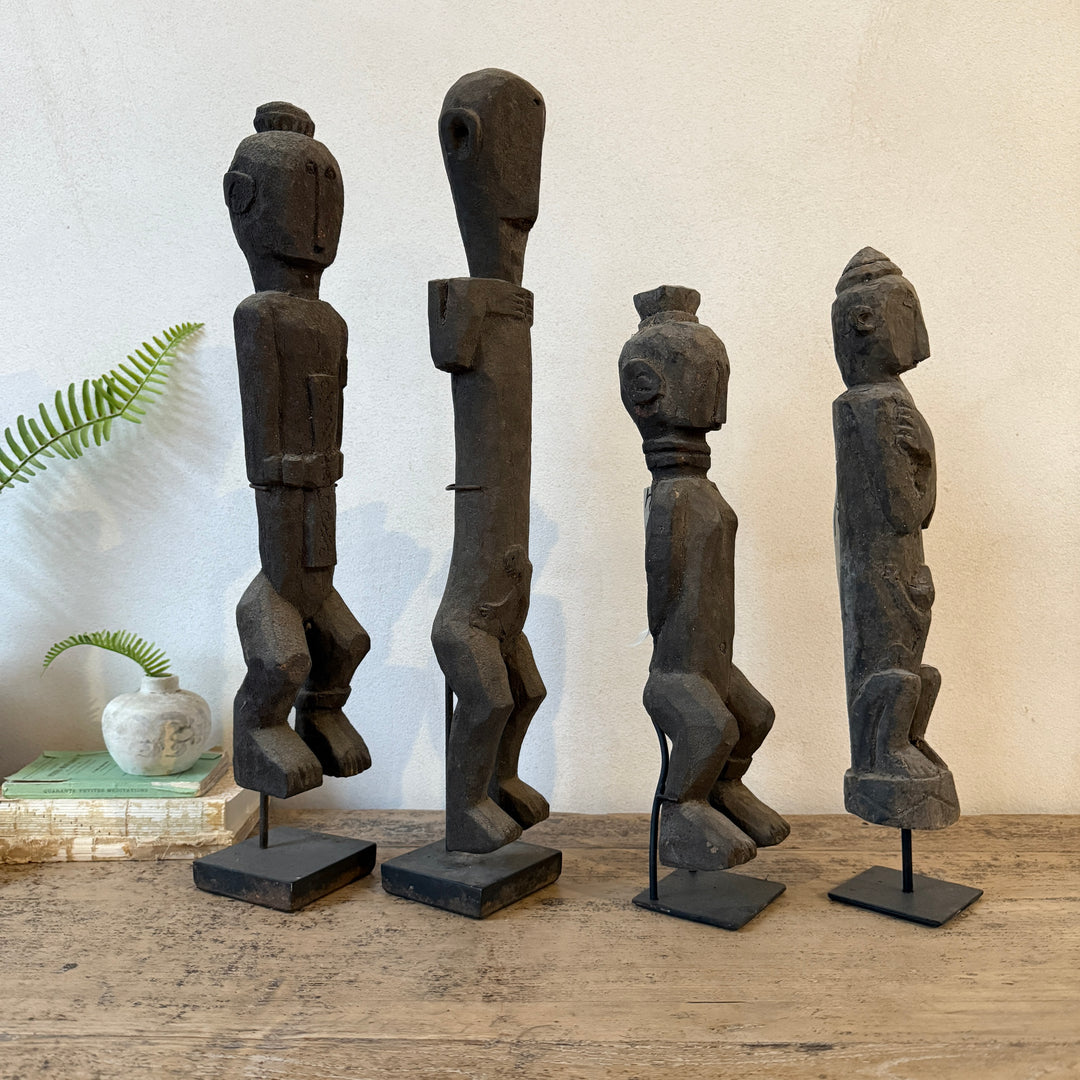 Antique wooden statues on stand | Jaya