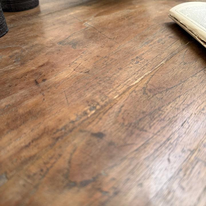 Detailed view of the Henley reclaimed teak dining table showing authentic historic markings, natural grain and handcrafted reclaimed wood.
