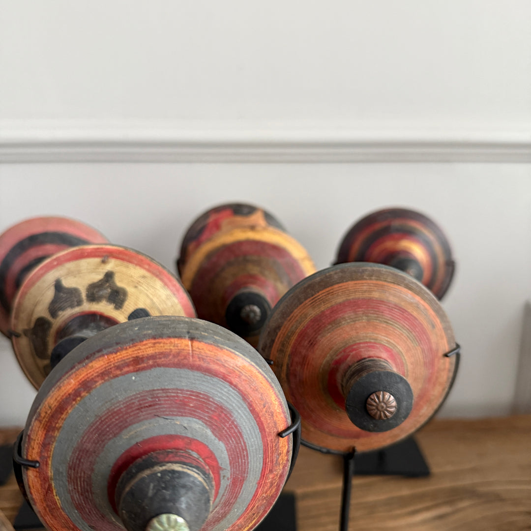 Antique small spinning top on stand