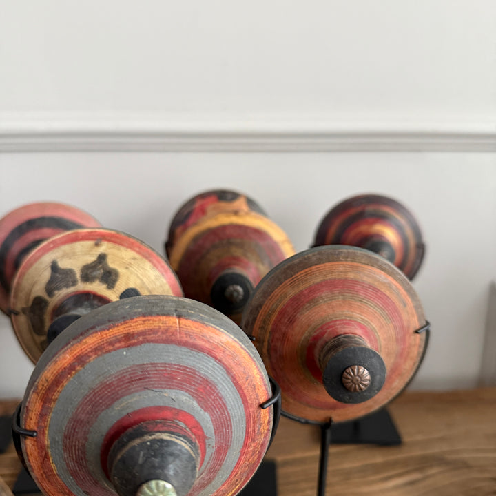 Antique small spinning top on stand