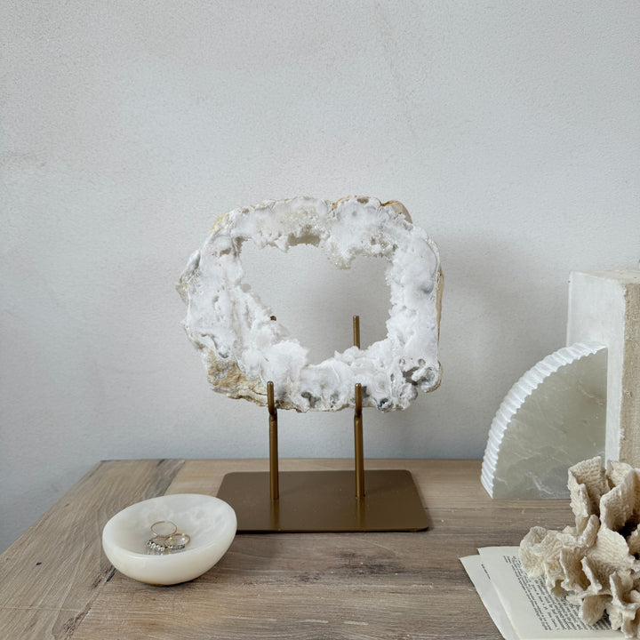 Natural crystal sculpture on stand