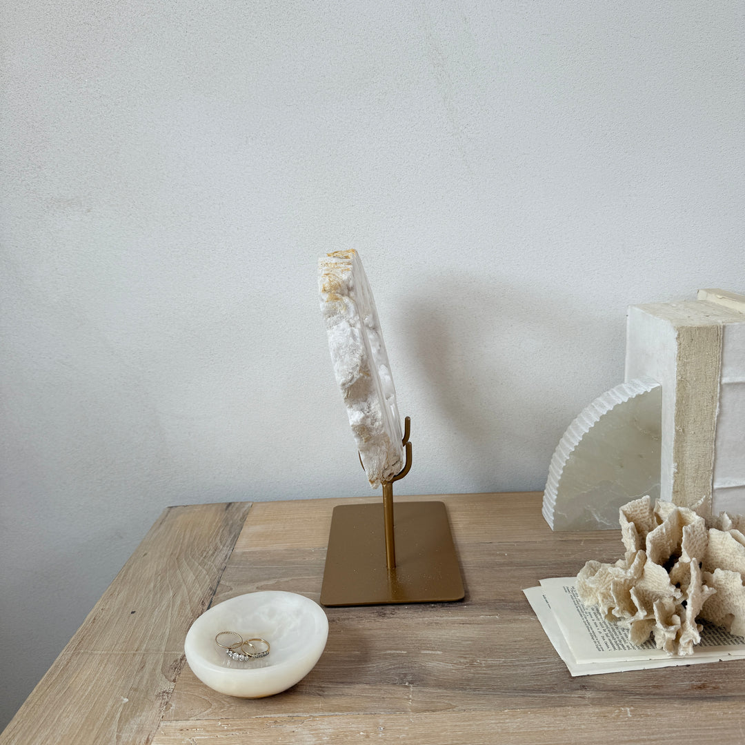 Natural crystal sculpture on stand