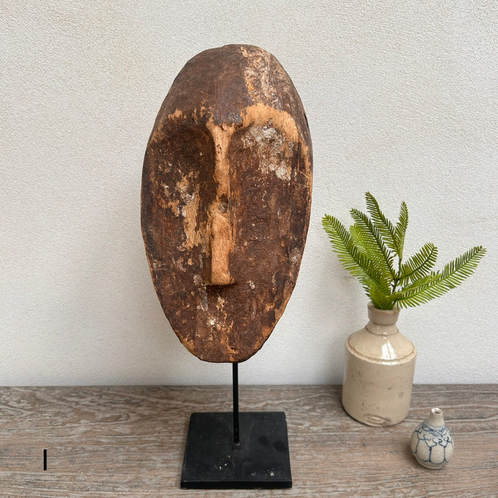 Antique West African tribal mask on stand