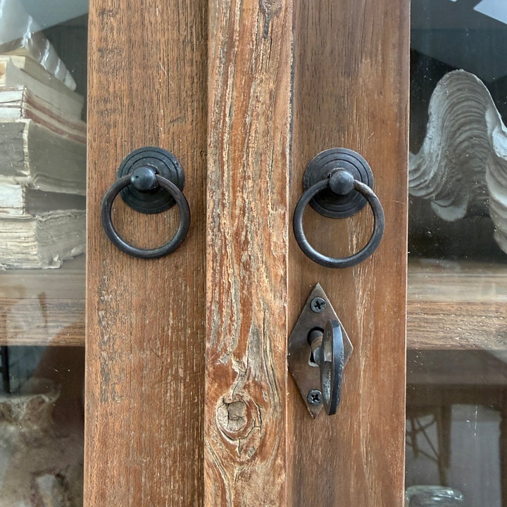 Close-up of the Eton reclaimed teak glazed cabinet showing traditional iron ring handles, key escutcheon and reclaimed timber detailing.