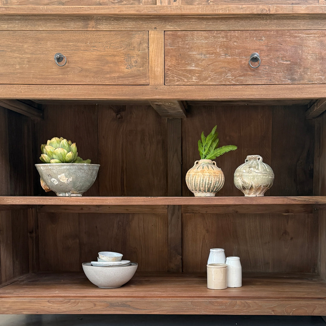 nterior shelving of the Eton reclaimed teak display cabinet showing spacious solid wood storage for ceramics, glassware and decorative accessories.