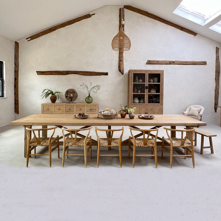 Extra large reclaimed pine dining table with mixed seating in a characterful country dining room