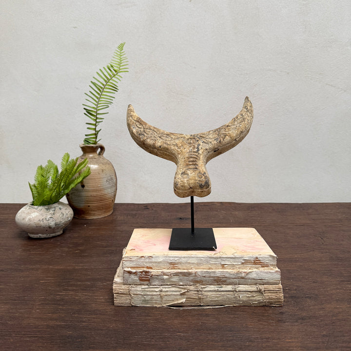 Primitive wooden cow horn sculpture