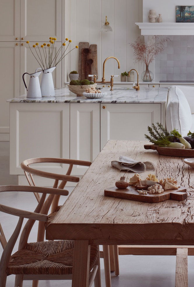 Hand Crafted Salvaged Dining Table in a kitchen with marble top counter