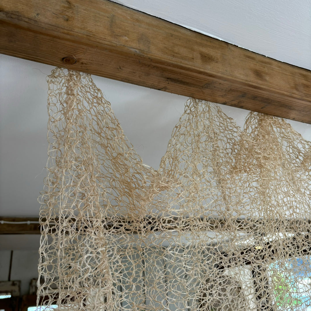 Hand knitted sisal curtain