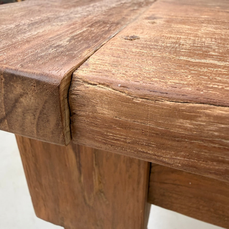 Corner detail of the Henley reclaimed teak dining table showing the traditional breadboard end joint and beautifully handcrafted solid reclaimed teak construction.