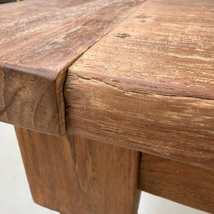 Corner detail of the Henley reclaimed teak dining table showing the traditional breadboard end joint and beautifully handcrafted solid reclaimed teak construction.