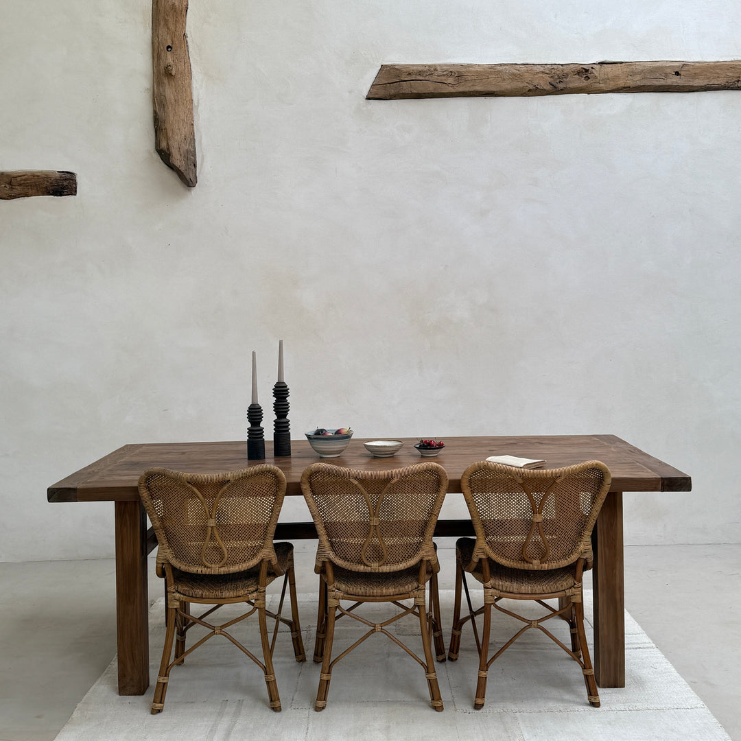 Henley reclaimed teak dining table comfortably seating six to eight people, ideal for family dining and relaxed entertaining.