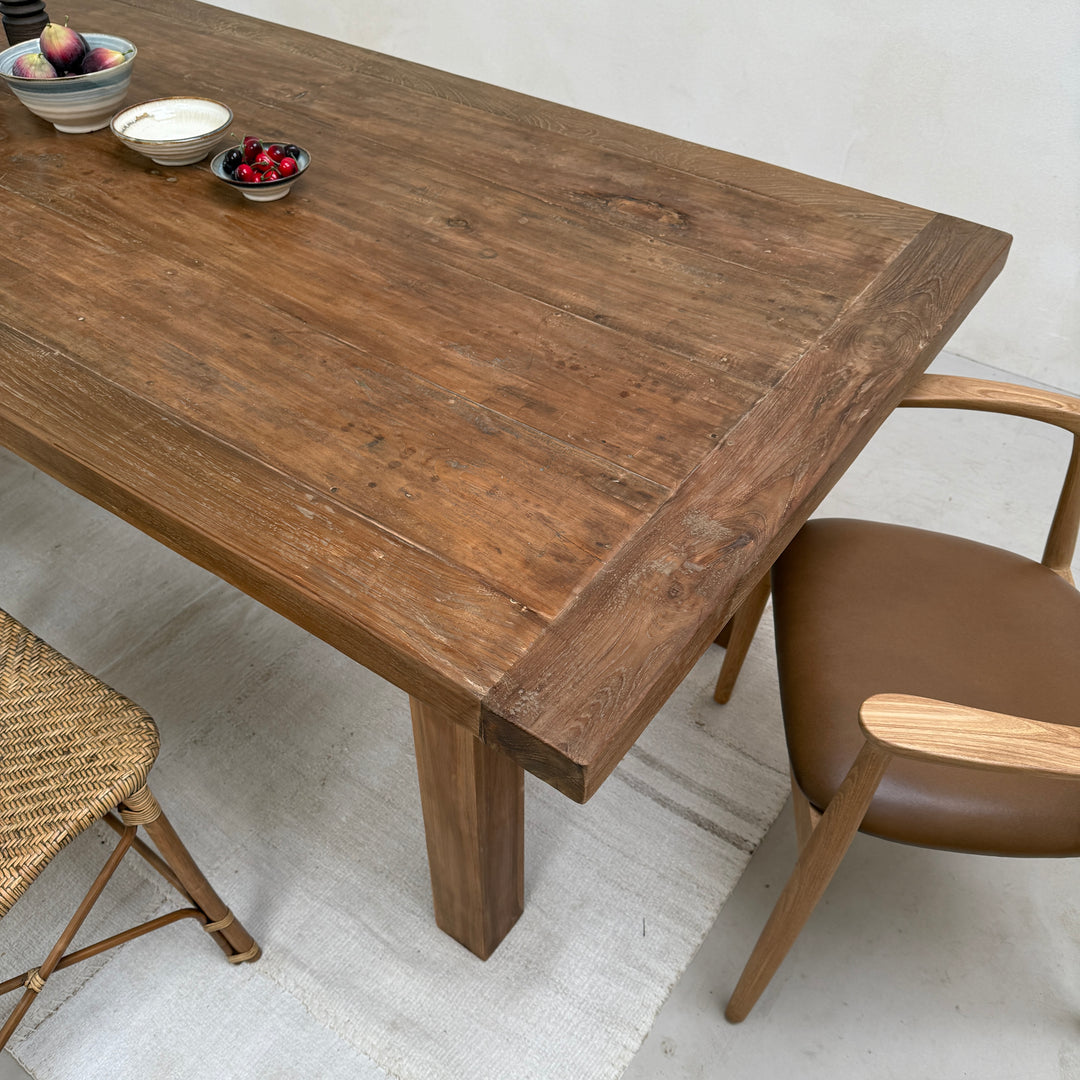 Side view of the Henley reclaimed teak dining table with solid salvaged teak construction and timeless contemporary country styling.