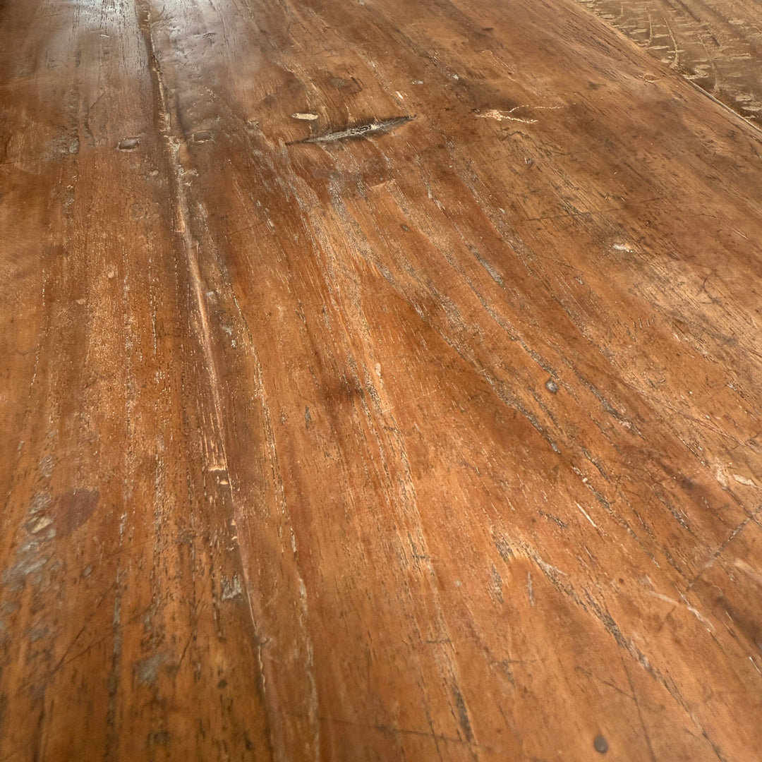 Close-up of the Henley reclaimed teak dining table displaying the rich patina, weathered grain and historic character of solid salvaged teak.