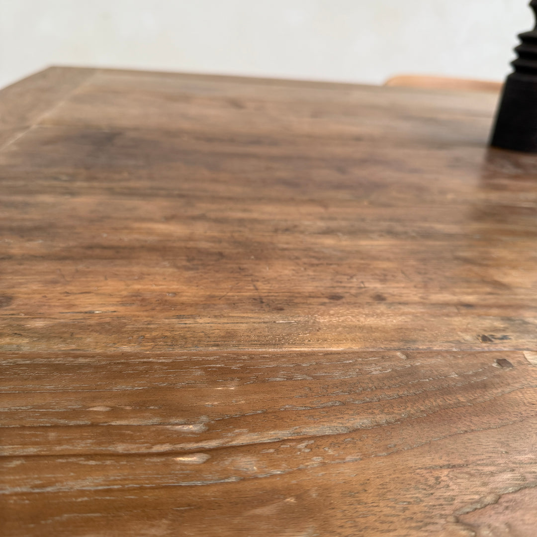 Close-up of the Henley solid reclaimed teak dining table highlighting the rich weathered grain and beautifully aged salvaged timber.