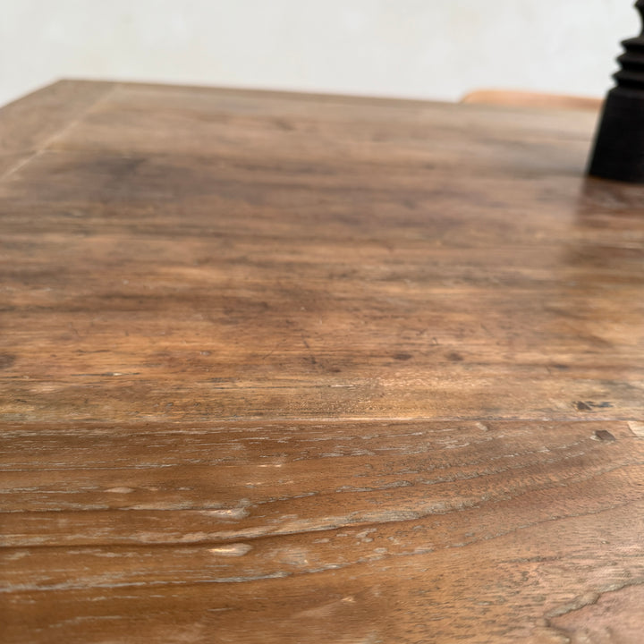 Close-up of the Henley solid reclaimed teak dining table highlighting the rich weathered grain and beautifully aged salvaged timber.