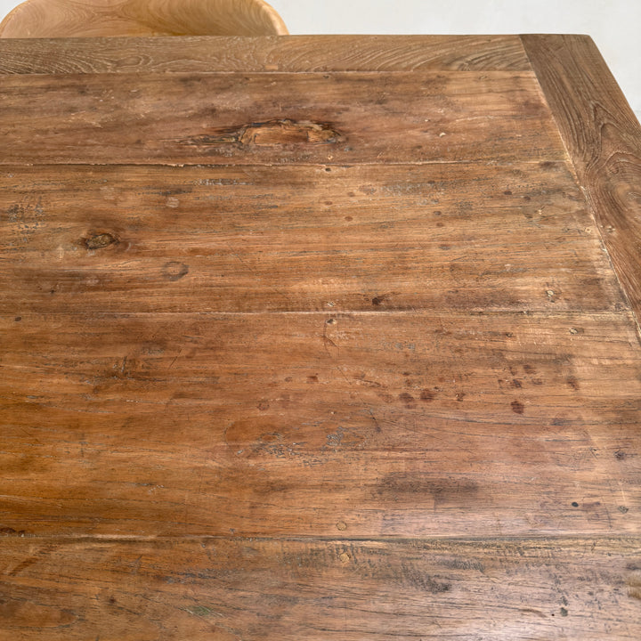 Detailed view of the Henley reclaimed teak dining table highlighting warm timber tones, historic grain patterns and authentic reclaimed wood texture.