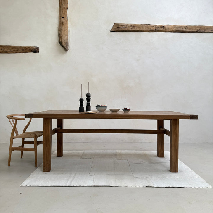 Henley solid reclaimed teak dining table handcrafted from salvaged timber with authentic historic grain and timeless understated design.
