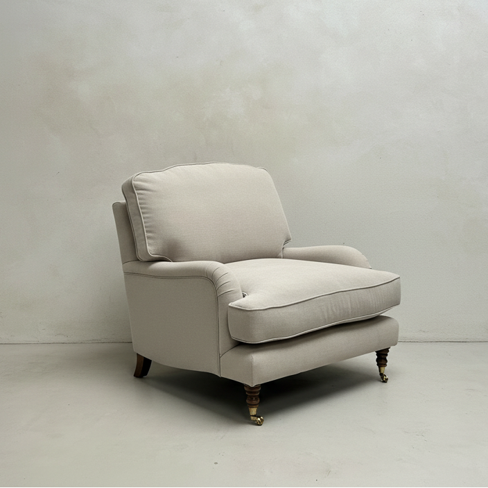 Beige armchair on a white floor with a plain white wall background