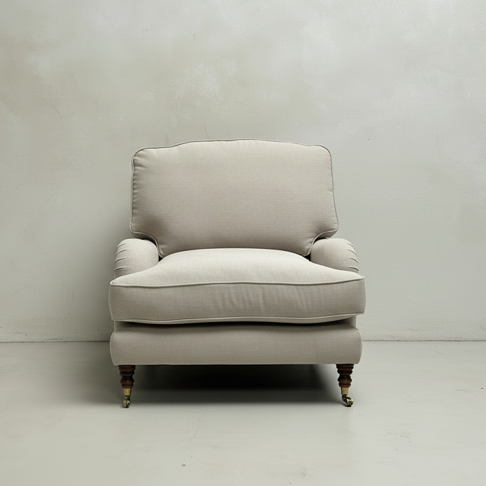 Beige armchair against a plain white wall