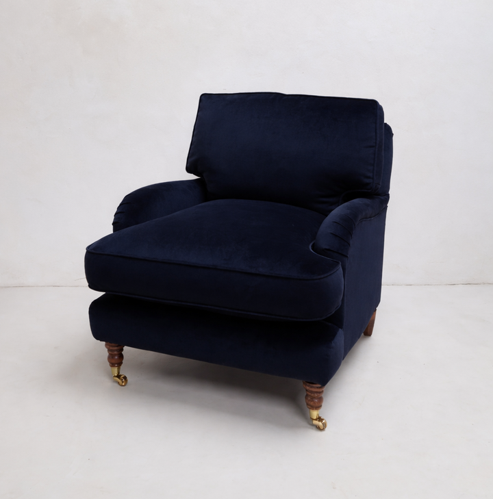 Navy blue armchair on a white background