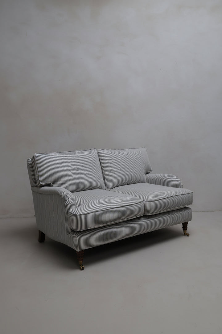 Heritage Stripe 2-seater sofa Beaconsfield  in white studio
