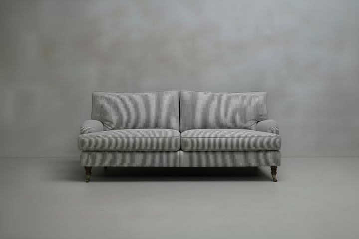 Navy striped sofa against a plain grey background