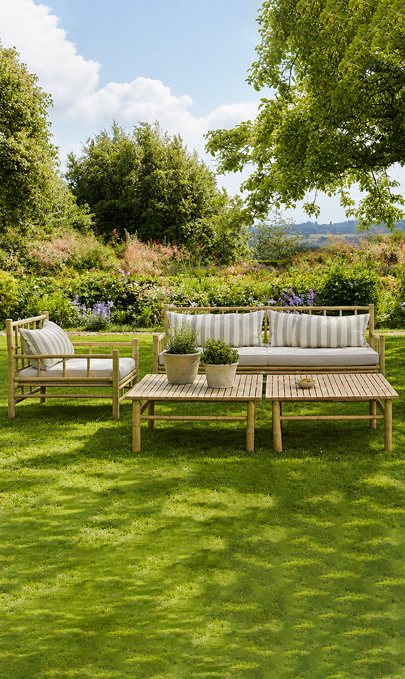 Outdoor garden setting featuring a bamboo furniture set