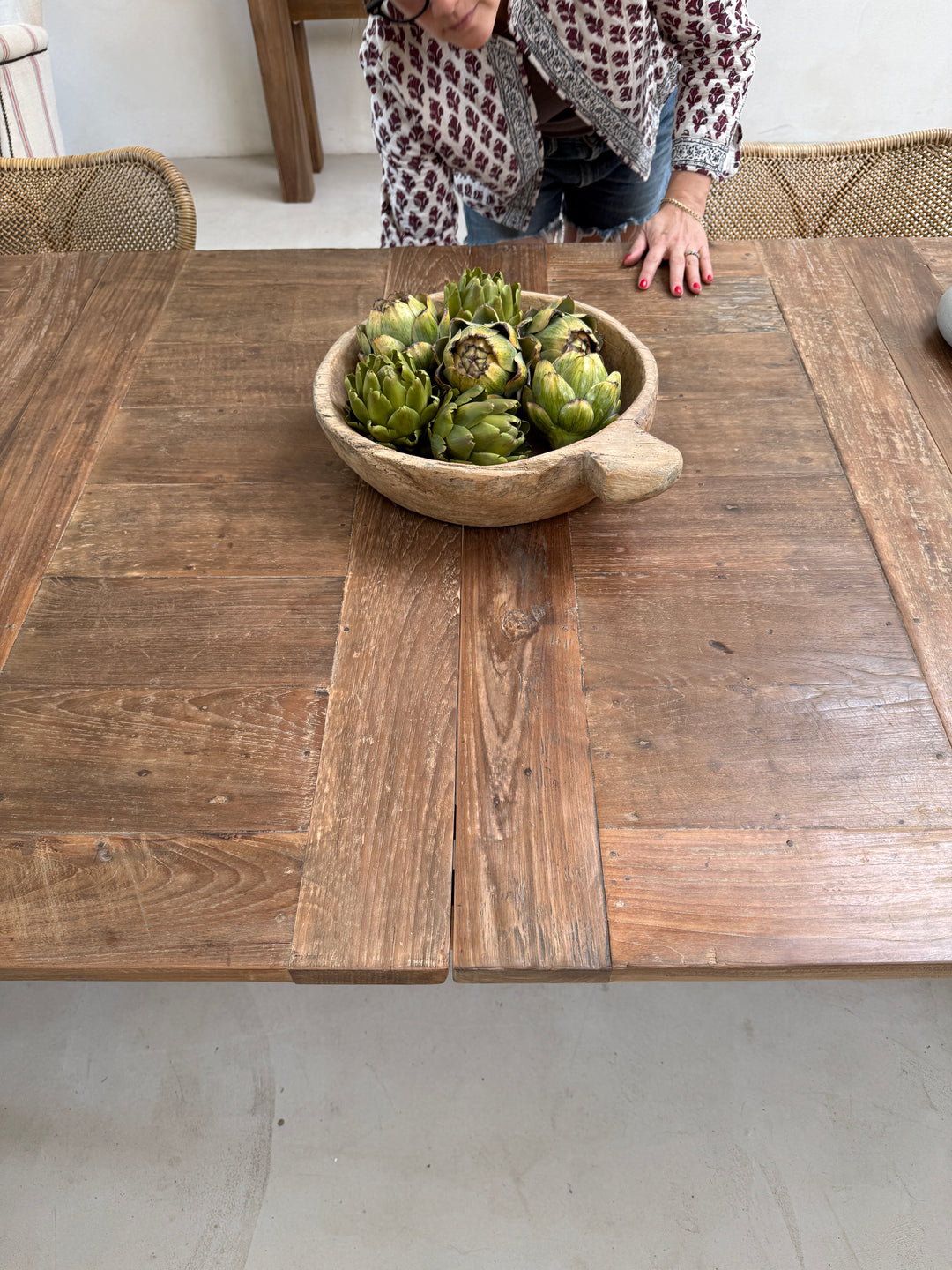 Front elevation of the reclaimed wood dining table highlighting its balanced proportions, handcrafted trestle base and the timeless beauty of reclaimed teak.