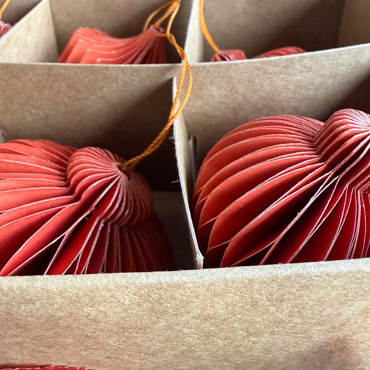 Box of six folded paper traditional decorations | Red