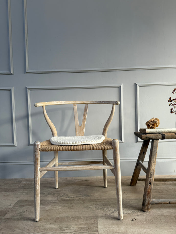 Curled wool seat pad