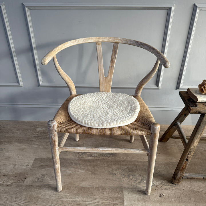 Curled wool seat pad