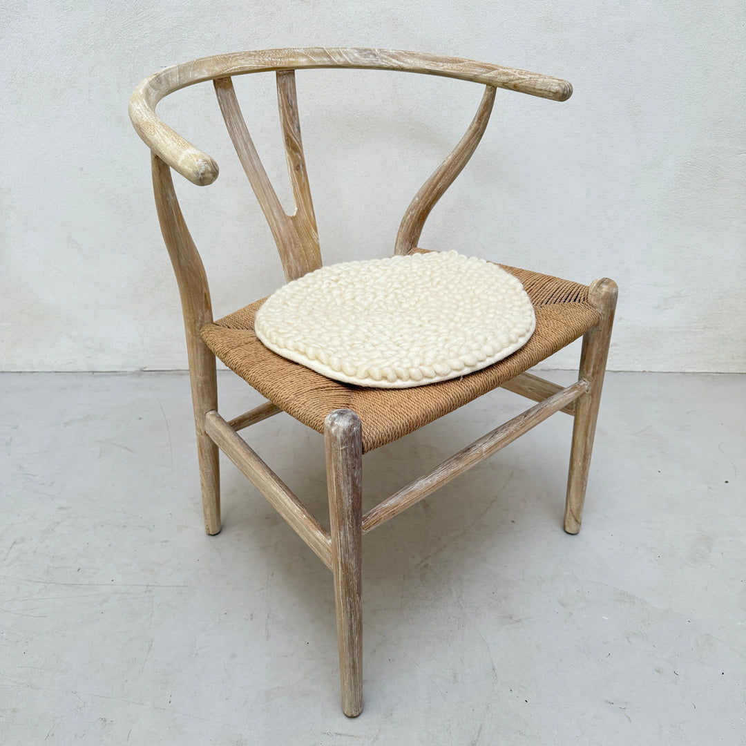 Curled wool seat pad