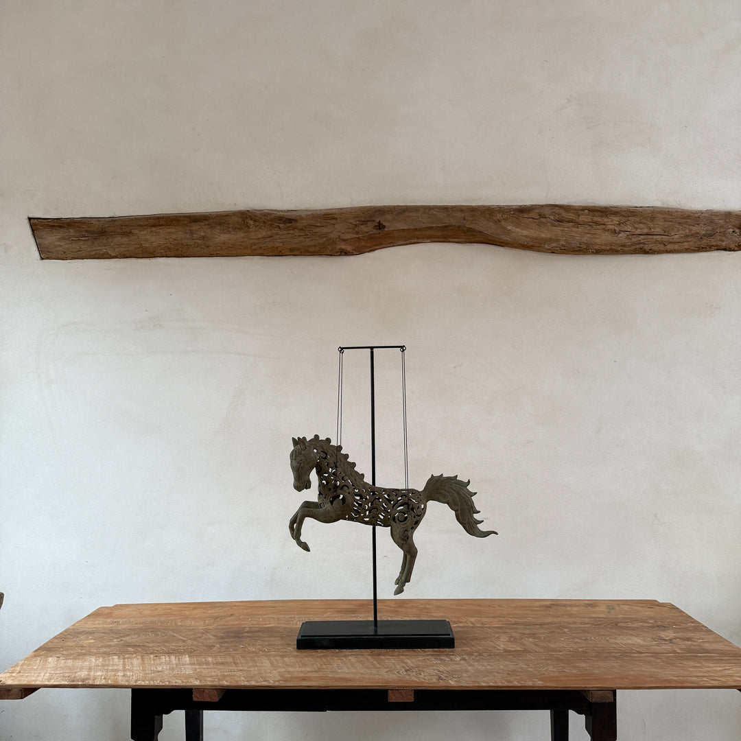 Large suspended bronze horse on stand