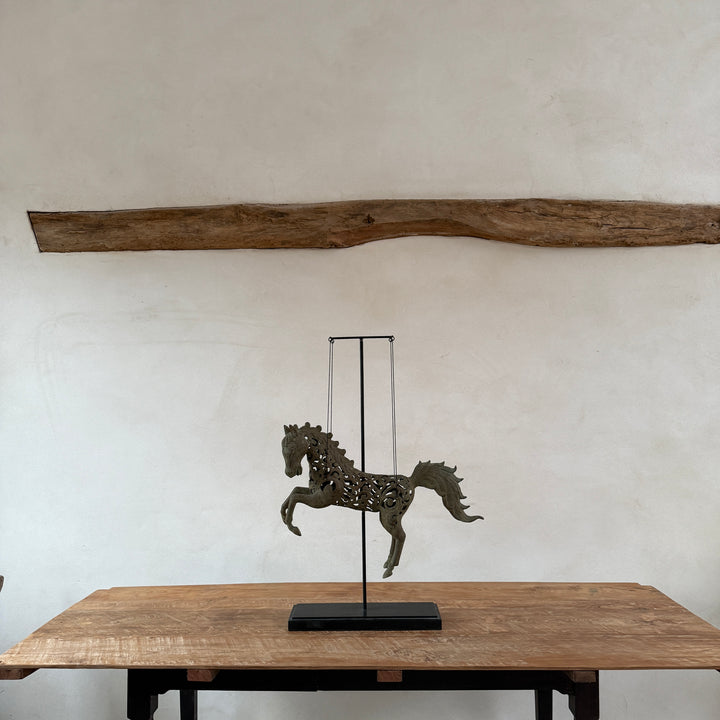 Large suspended bronze horse on stand