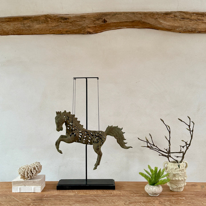 Large suspended bronze horse on stand