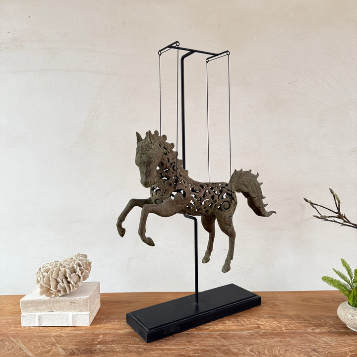 Large suspended bronze horse on stand