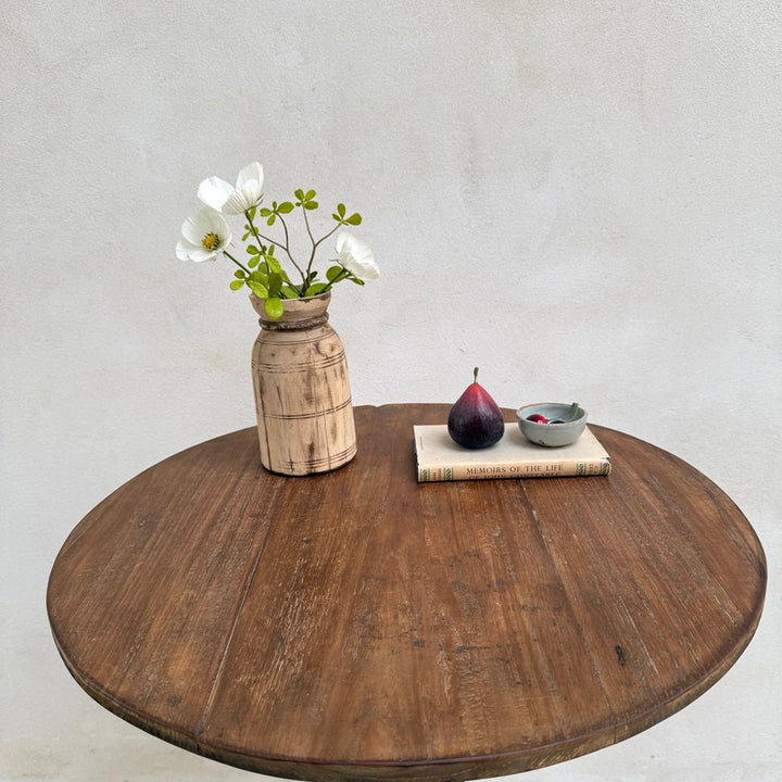 Angled overhead photograph of the Knepp solid teak round occasional table highlighting its elegant proportions, handcrafted craftsmanship and premium timber.