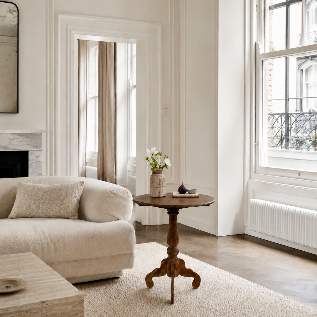 Knepp handcrafted solid teak side table styled beside a sofa in a contemporary living room, ideal as a lamp table or elegant wooden side table.